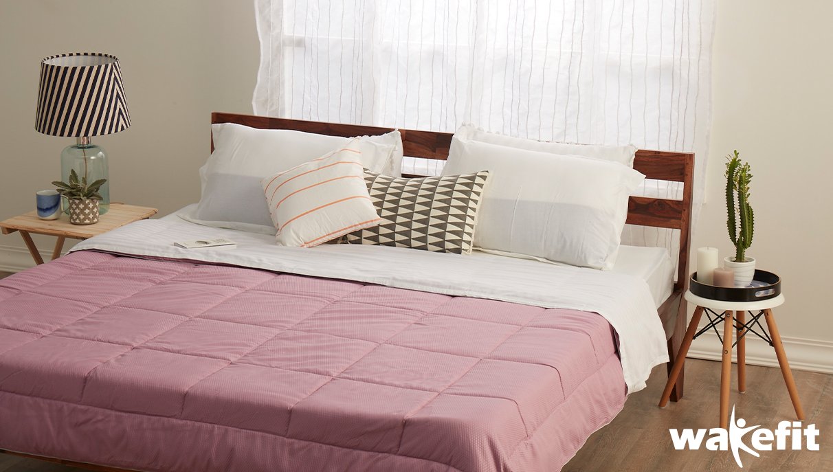 Mattress, pillows, bedcovers, and other products from Wakefit. 